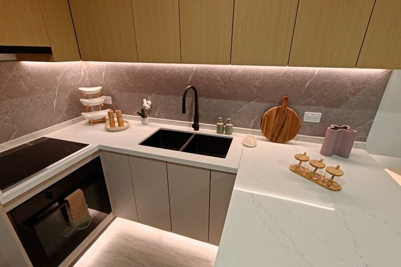 Kitchen with stone benchtops and LED strip lighting