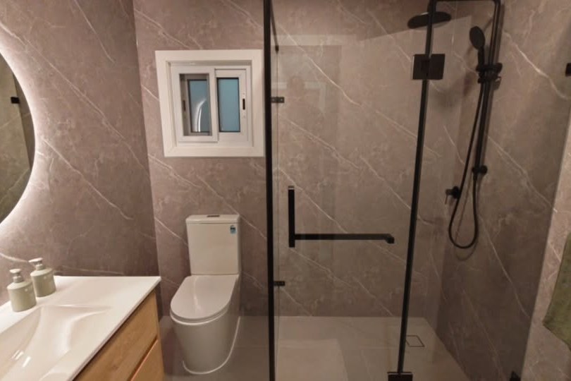 Bathroom with LED mirror and walk-in shower