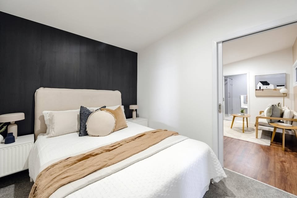 Bedroom with sliding door to the living area